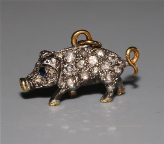 A Victorian style diamond set miniature pig pendant, with gem set eyes, 16mm.